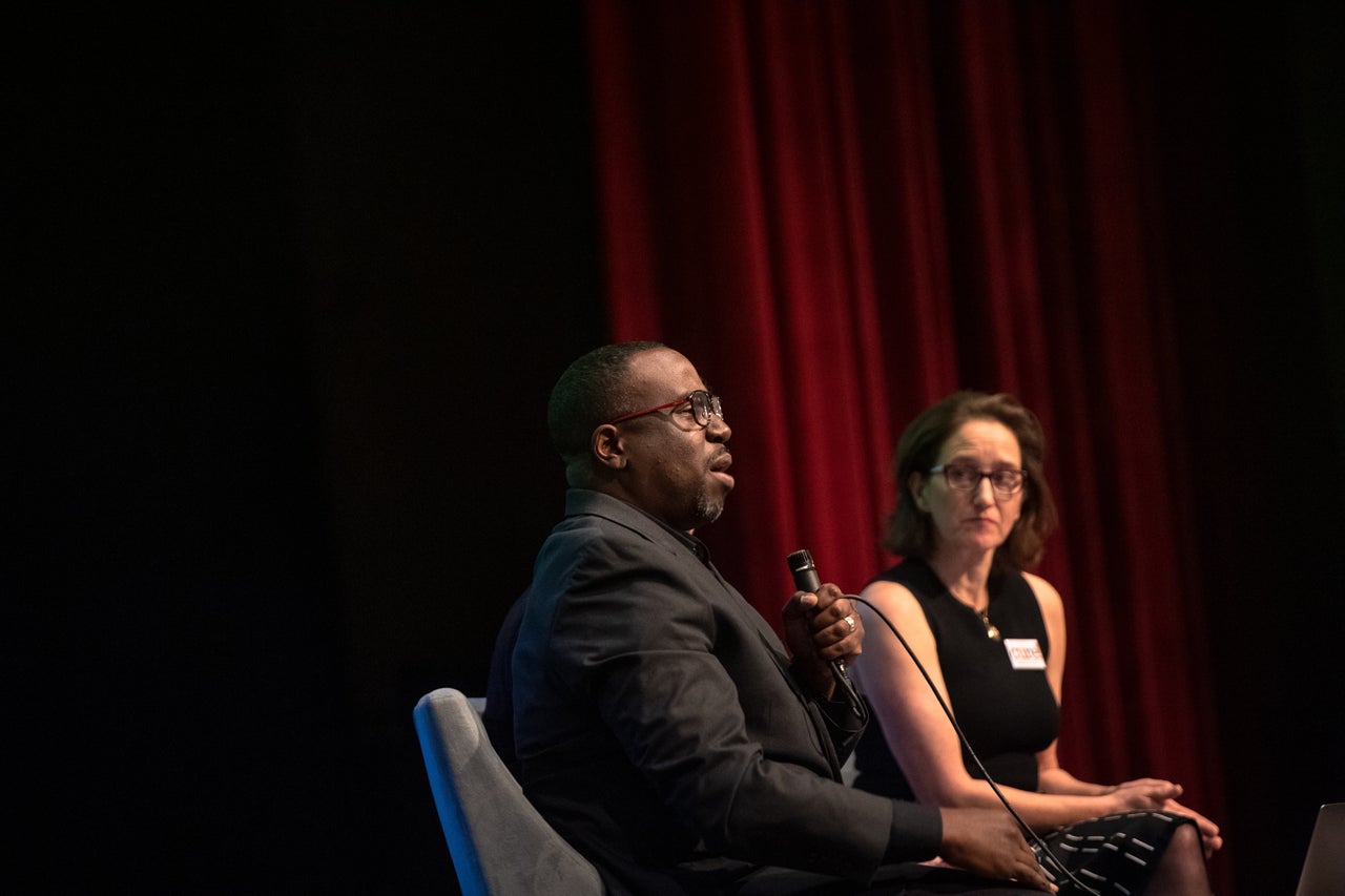 Professor Chenjerai Kumanyika and John Biewen speak about their podcast "Scene on Radio, Seeing White" at the Larchmont meeting.