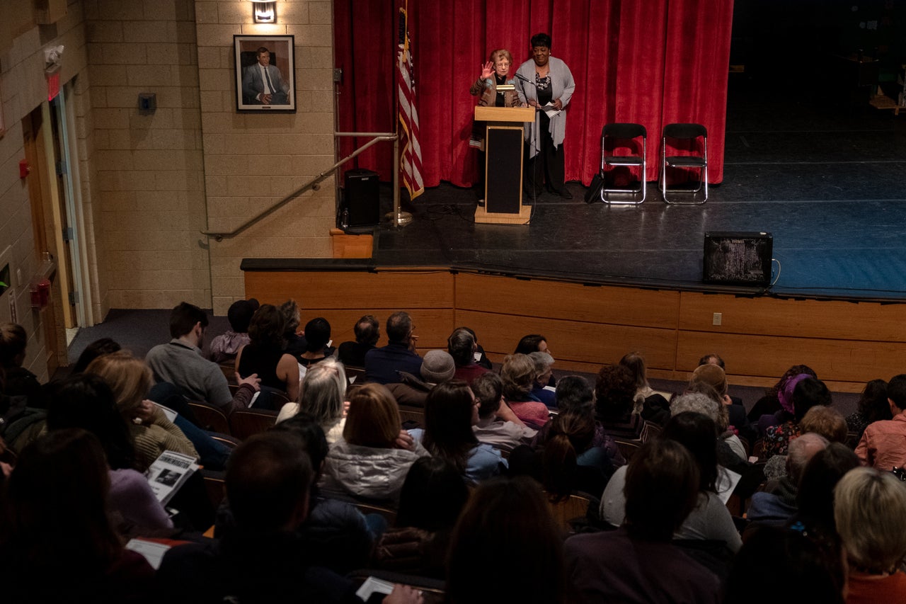 Mary Lee Berridge introduces teacher Shannon Tuner-Porter at the 32nd annual Dr. Martin Luther King Jr. Commemoration at Hommocks Middle School on Sunday.