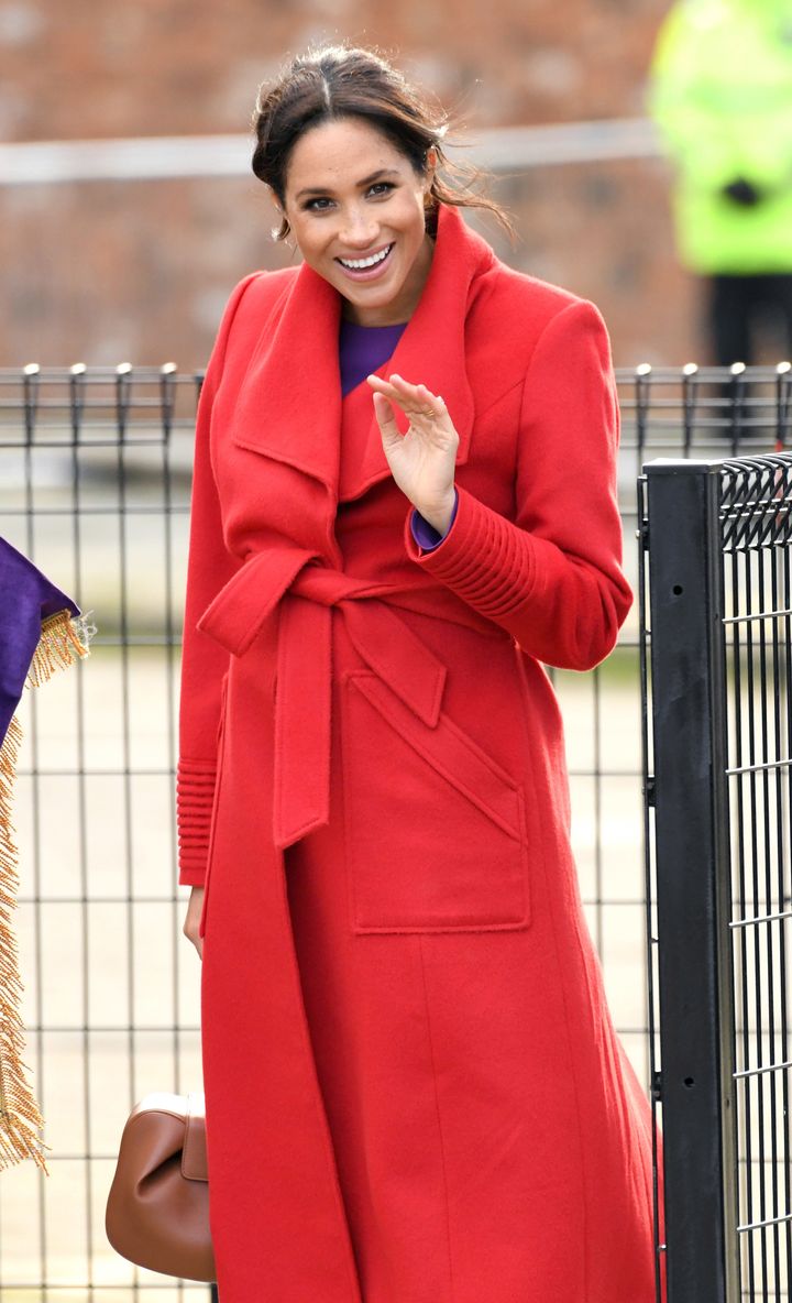 The Duchess of Sussex wore a bold red Sentaler coat on Monday.