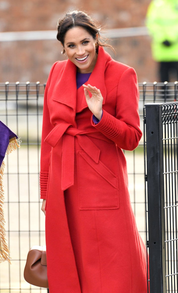 The Duchess of Sussex wore a bold red Sentaler coat on Monday.