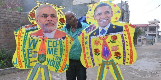 AMRITSAR, INDIA - JANUARY 21: An Indian kitemaker poses with kites adorned with images of US President Barack Obama (R) and Indian Prime Minister Narendra Modi (L) on January 21, 2015 in Amritsar, India. Barack Obama arrives in India this weekend for an unprecedented second visit by a serving US president, the honoured guest of Prime Minister Narendra Modi who was still a Washington outcast a year ago. (Photo by Sameer Sehgal/Hindustan Times via Getty Images)