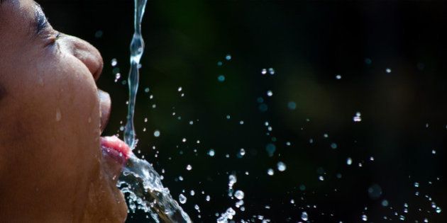 Splash of water on the mouth of a girl child