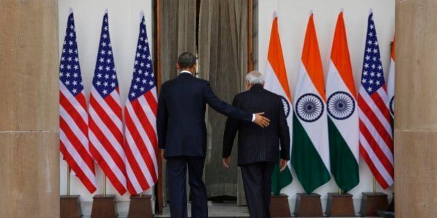 U.S. President Barack Obama, left and Indian Prime Minister Narendra Modi walk into the Hyderabad House, the venue of their talks in New Delhi, India, Sunday, Jan. 25, 2015. Obama's arrival Sunday morning in the bustling capital of New Delhi marked the first time an American leader has visited India twice during his presidency. Obama is also the first to be invited to attend India's Republic Day festivities, which commence Monday and mark the anniversary of the enactment of the country's democratic constitution. (AP Photo/Manish Swarup)