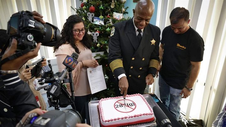Sheriff Garry McFadden of Mecklenburg County, North Carolina, celebrates his election in November by slicing a cake frosted with a message in protest of 287(g), the federal immigration enforcement and deportation program he pledged to end. 