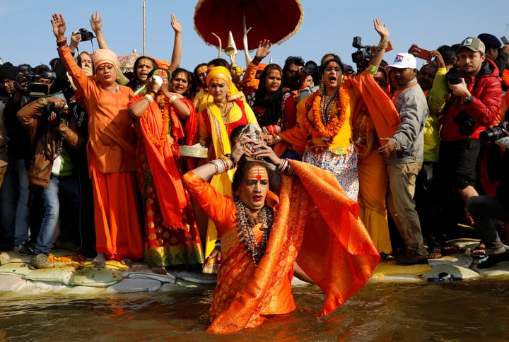 Lakshmi Narayan Tripathi, chief of the Kinnar Akhara congregation for transgender people, takes a dip during the first grand bath at Kumbh Mela on January 15, 2019. 