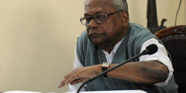 Kerala Chief Minister V.S. Achuthanandan reads a document during the Communist Party of India (Marxist) Polit Bureau meeting in New Delhi on February 14, 2009. The Congress in Kerala said the party expected that the ongoing meeting of the CPI(M) Polit Bureau in New Delhi would take an appropriate decision on the SNC Lavalin issue. Kerala Pradesh Congress Committee (KPCC) president Ramesh Chennithala, who was leading a statewide 'Kerala Raksha' march, said the Polit Bureau would take a reasonable decision on the CBI request seeking the nod of the Kerala government for prosecution of the accused, including CPI(M) State Secretary Pinarayi Vijayan. AFP PHOTO/ Prakash SINGH (Photo credit should read PRAKASH SINGH/AFP/Getty Images)