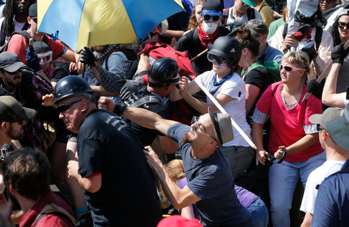 <p>White nationalists clash with protesters at the Aug. 12, 2017 Charlottesville, Va. rally that turned deadly violent. </p>
