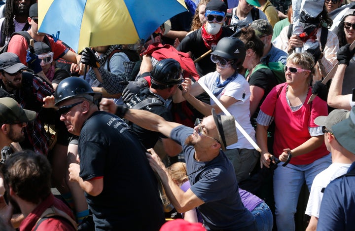 White nationalists clash with protesters at the Aug. 12, 2017 Charlottesville, Va. rally that turned deadly violent. 