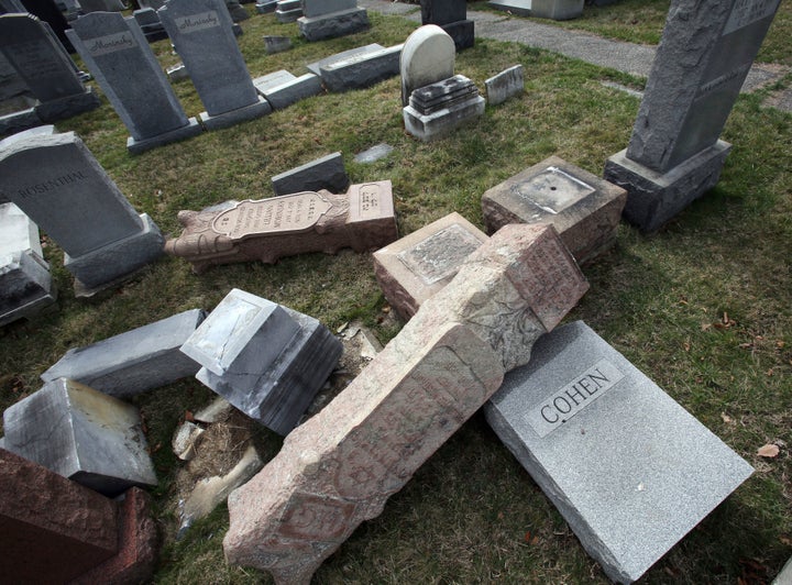 <p>Toppled headstones at Mount Carmel Cemetery in Philadelphia Feb. 27, 2017. A report on the vandalism cited an increase in anti-Semitic bias since the 2016 election. </p>