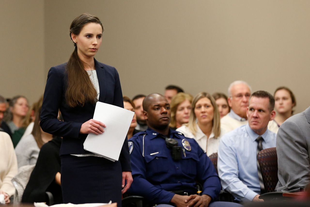 Rachael Denhollander speaks as former Michigan State University and USA Gymnastics doctor Larry Nassar listens to impact statements during the sentencing phase in Ingham County Circuit Court on January 24, 2018 in Lansing, Michigan.More than 100 women and girls accuse Nassar of a pattern of serial abuse dating back two decades, including the Olympic gold-medal winners Simone Biles, Aly Raisman, Gabby Douglas and McKayla Maroney -- who have lashed out at top sporting officials for failing to stop him. / AFP PHOTO / JEFF KOWALSKY (Photo credit should read JEFF KOWALSKY/AFP/Getty Images)