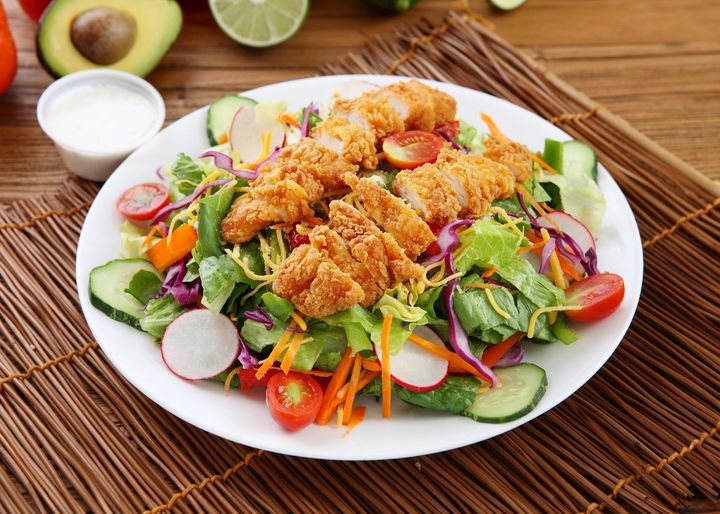 Try subbing grilled chicken or even a burger patty for fried chicken to get healthier protein.
