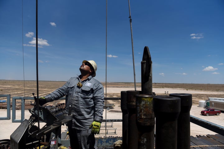 A contractor works on a drilling site in the Permian Basin, a massive field stretching from Texas to New Mexico.