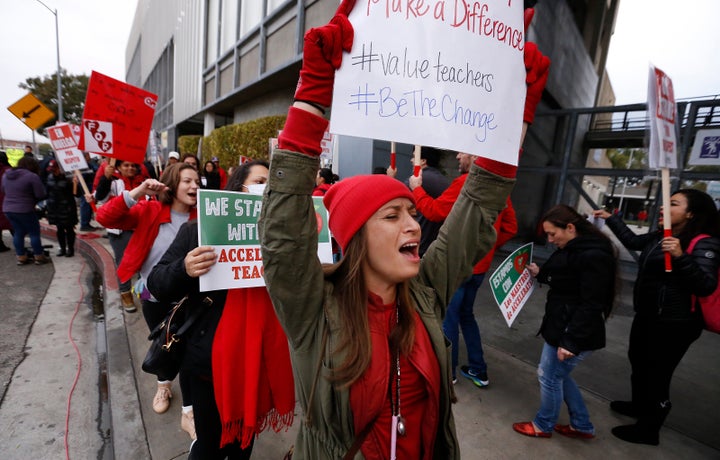 Educators picket outside the Accelerated Charter Schools building. Among the protesters were teachers from the network's schools, who started their own strike on Jan. 15.