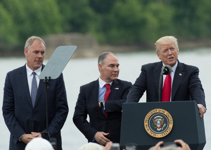 Trump and his initial appointees to run the Interior Department and the EPA — Ryan Zinke (left) and Scott Pruitt (center) — declared war on environmental protection.