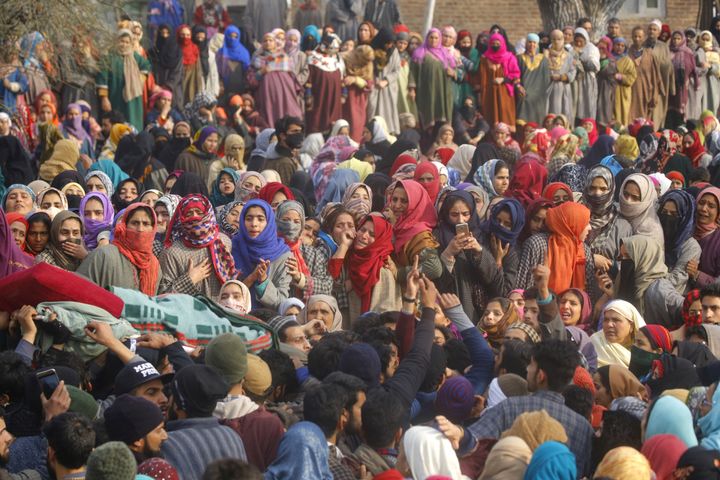 Mourners at the funeral of a militant in Srinagar in December. A senior police officer says Kashmiri policemen undergo a lot of pressure, especially during the deaths or funerals of civilians and militants killed in the conflict.