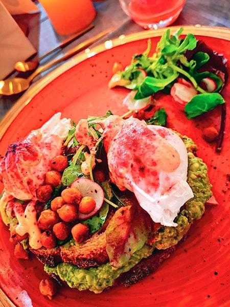 Avocado and eggs with spiced chickpeas and halloumi at Brother Hubbard North.