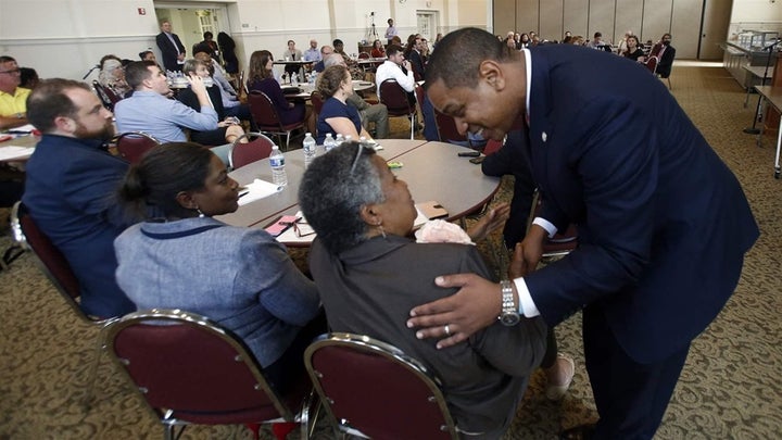 Virginia Lt. Gov. Justin Fairfax, a Democrat, greets attendees after remarks at a 2018 meeting of the Campaign to Reduce Evictions in Richmond, Virginia. 