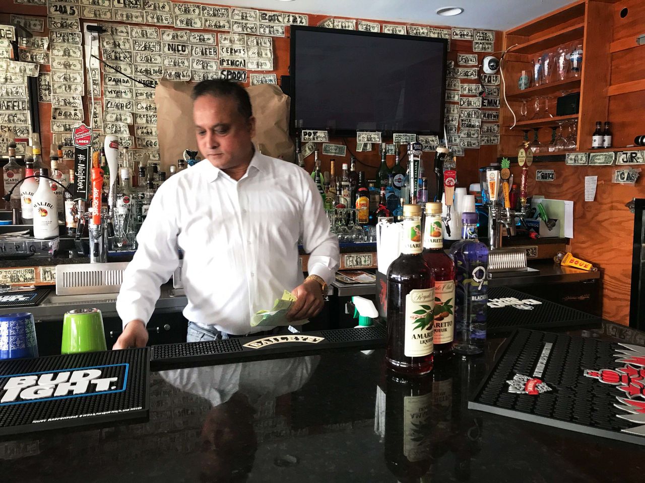 Fazly Rabbi, owner of the Coast Guard cadet hangout bar Slice, said he fears another slow weekend as cadets cut back during the shutdown.