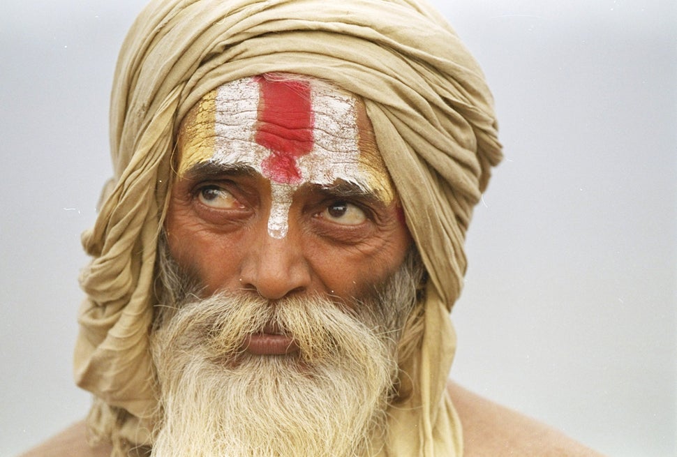 A sadhu listens to a speech marking the first anniversary of the destruction of the Babri Mosque in Ayodhya, December 6, 1992.