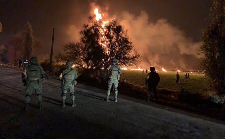 Soldiers guard the area by an oil pipeline explosion in Tlahuelilpan, Hidalgo state.