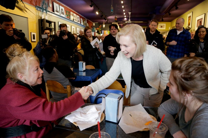 Gillibrand greets voters at the Pierce Street Coffee Works café in Sioux City, Iowa, on Friday. At that stop and other