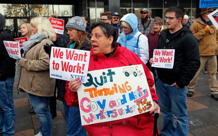 Internal Revenue Service workers attend a protest rally at the federal building on Jan. 10, 2019, in Ogden, Utah.