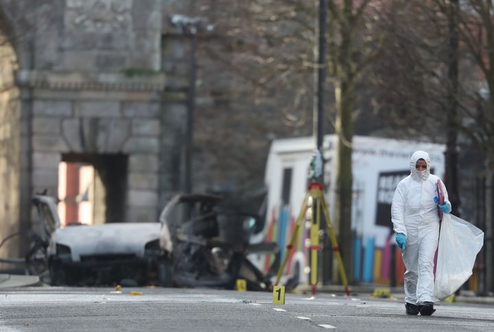 Forensic investigators at the scene of a car bomb blast on Bishop Street in Londonderry