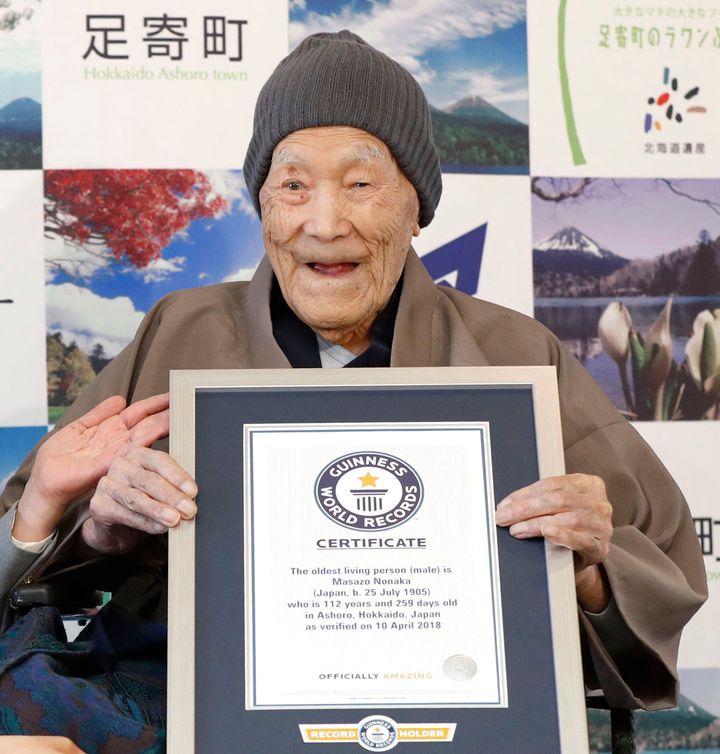 Masazo Nonaka, seen in April, eats cake after being recognized by Guinness World Records as the world's oldest living man in 2018.
