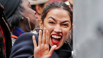 U.S. Rep. Alexandria Ocasio-Cortez, D-New York, waves to supporters as she arrives at a rally organized by Women's March NYC at Foley Square in Lower Manhattan, Saturday, Jan. 19, 2019, in New York. (AP Photo/Kathy Willens)