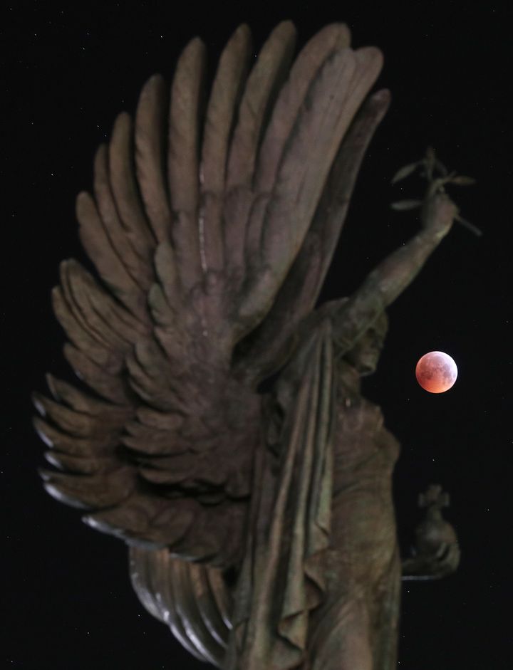 A super blood wolf moon over the peace statue on Brighton seafront during a lunar eclipse.