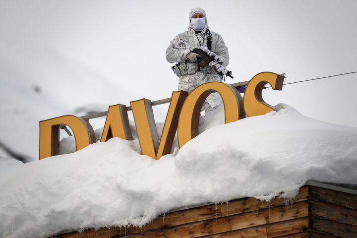 A policeman stands on the rooftop of a hotel before the start of the World Economic Forum meeting in Davos, Switzerland.