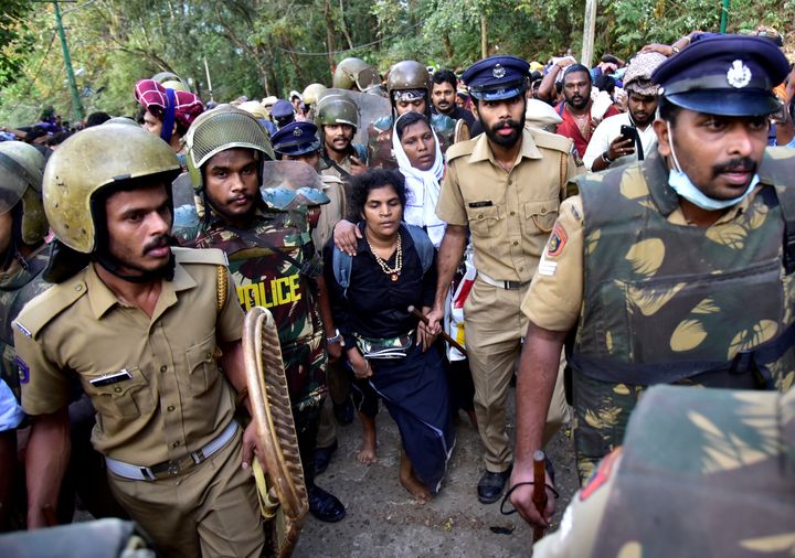 Bindu Ammini and Kanakadurga escorted by police after they attempted to enter the Sabarimala temple.