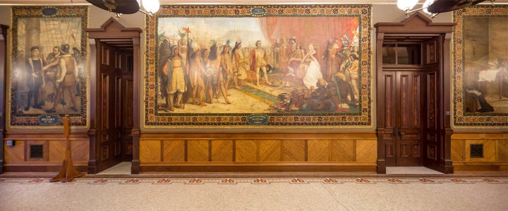 An October 2015 photo shows a Columbus mural in Notre Dame's Main Building.