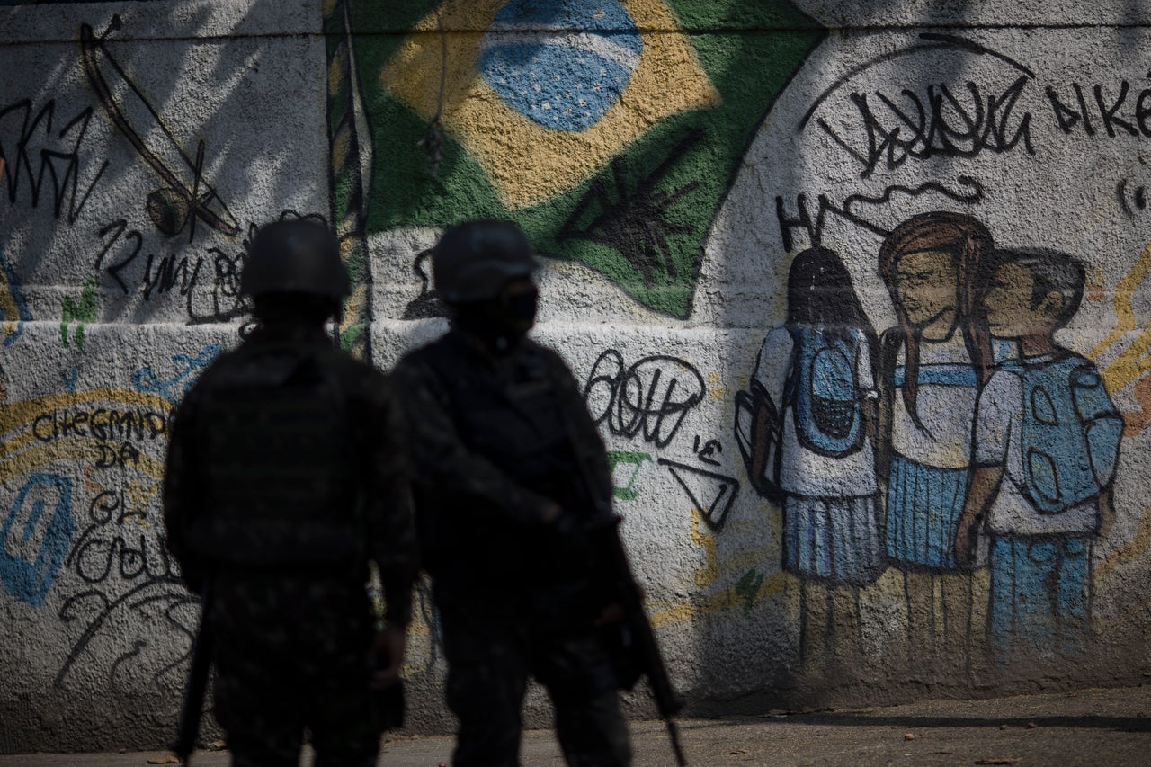 Soldiers patrol a favela neighborhood in Rio de Janeiro in August2018, a day after at least 11 people were killed during shootouts.