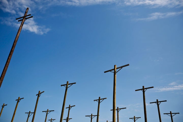 A row of telephone poles lines the skyline outside the Tennessee Valley Authority's long-dormant Bellefonte Nuclear Plant in Hollywood, Alabama.