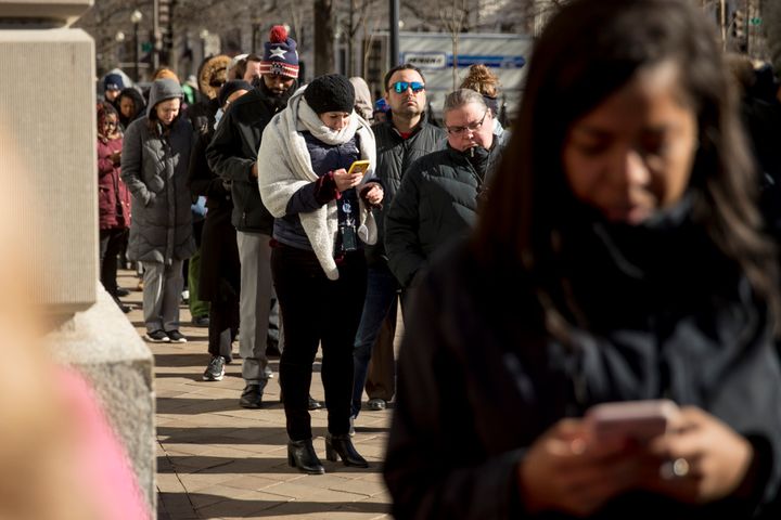 Furloughed government workers affected by the shutdown wait in line for free food and supplies at World Central Kitchen, the not-for-profit organization started by Chef Jose Andres, Tuesday, Jan. 22, 2019, in Washington.