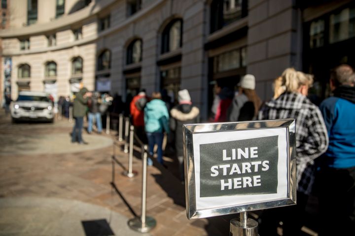 Furloughed workers wait in line on Tuesday to receive food and supplies from World Central Kitchen, the not-for-profit organization started by Chef Jose Andres in Washington, D.C.