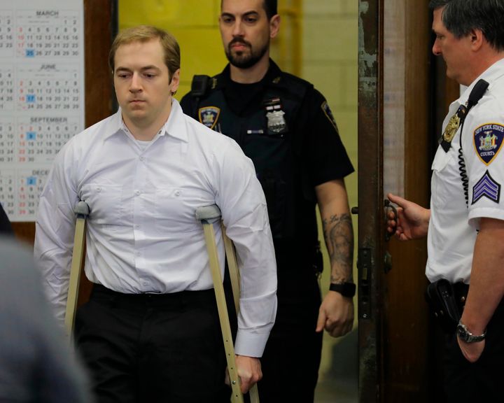 James Jackson, using crutches, is escorted into criminal court, Wednesday Jan. 23, 2019 in New York. Jackson, a white supremacist, pled guilty Wednesday, to killing a black man with a sword as part of a racist plot that prosecutors described as a hate crime. 