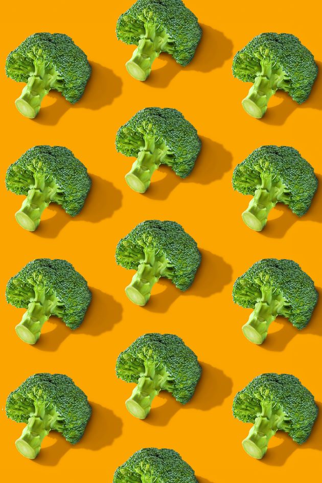 Colorful vegetables pattern of fresh hot broccolis on color background. From top view