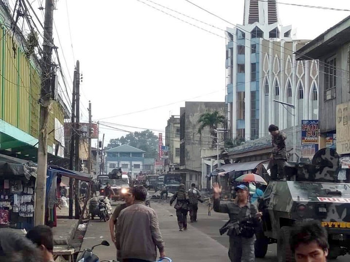 Soldiers and police cordon off the area after two bombs exploded outside a Roman Catholic cathedral.