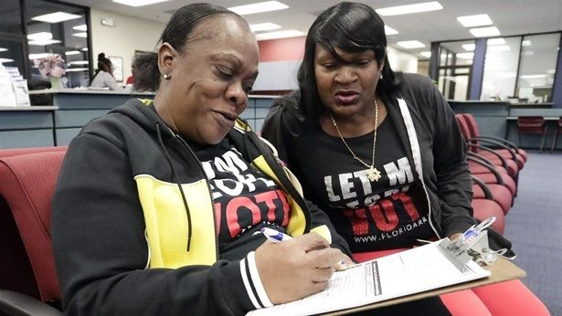 A woman at the Orange County Supervisor of Elections Office, in Orlando, registers to vote after a Florida ballot measure allowing ex-felons to vote. 