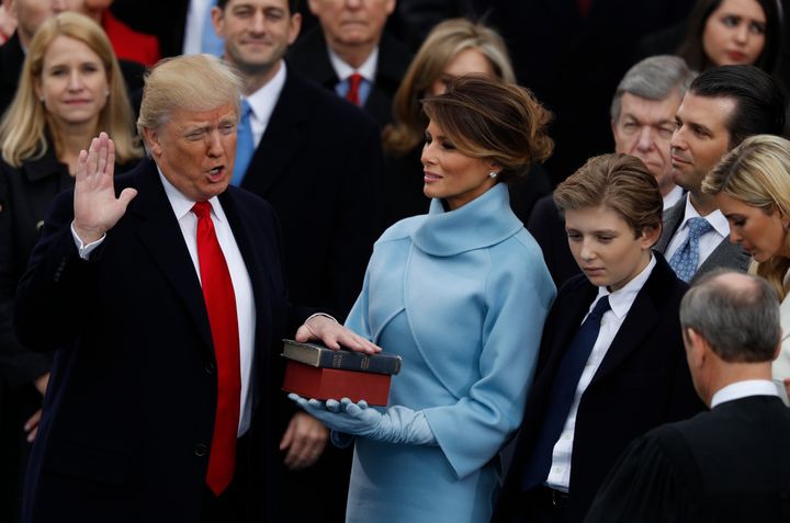 Donald Trump takes the oath of office with his hand on a Bible held by his wife on Jan. 20, 2017.