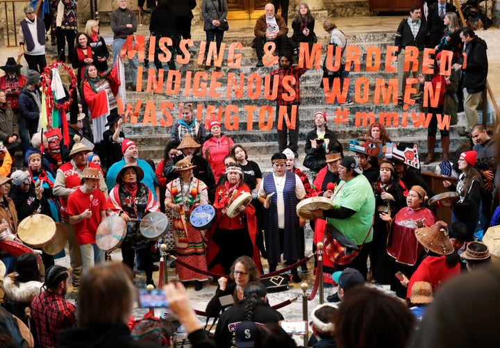 Native American tribal members sing and drum in the rotunda of the Capitol in Olympia, Washington, in January 2018. Their gathering was part of Native American Indian Lobby Day.