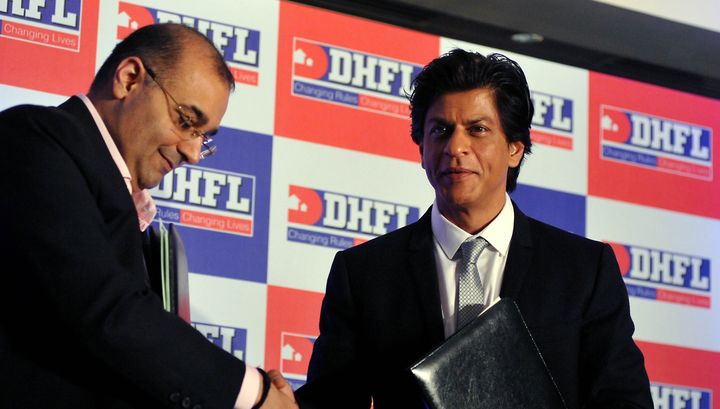 DHFL Managing Director Kapil Wadhawan (left) with actor Shah Rukh Khan.
