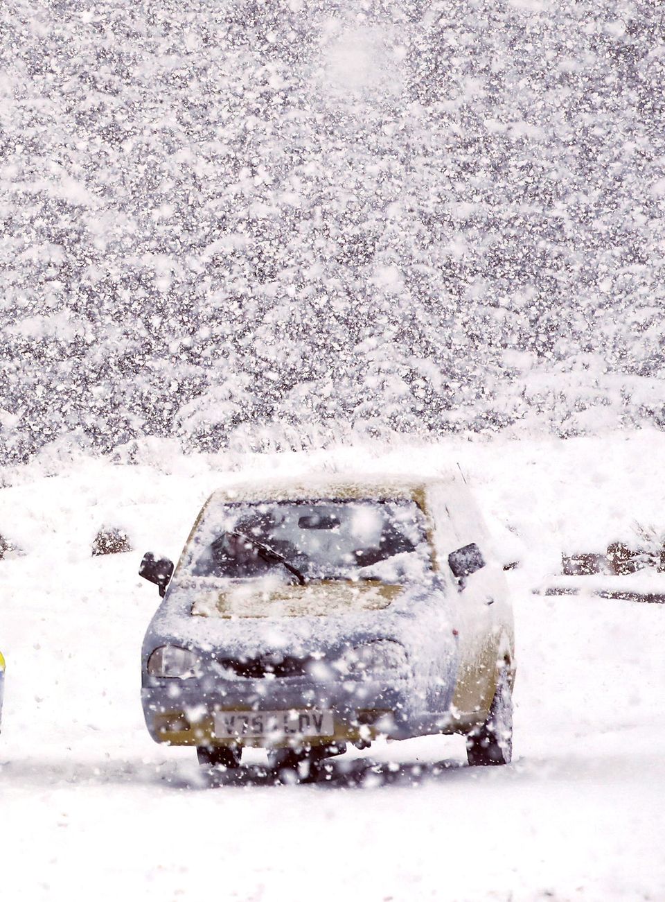 A Reliant Robin is covered with snow in Cheshire on Tuesday.