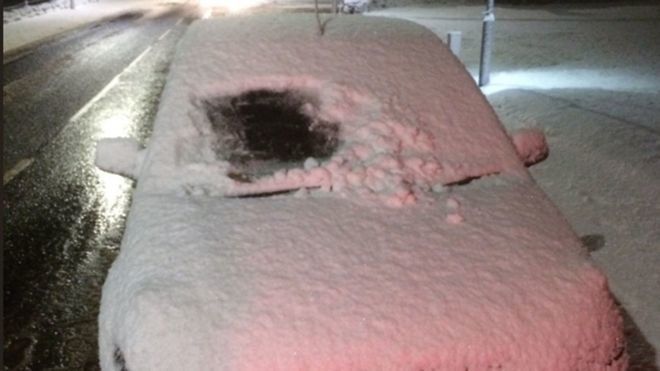 Say it ain't snow: Police in Scotland have issued a warning after a motorist was spotted driving with just a small square cut out of thick snow on his windscreen.