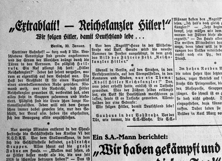 An archival photo shows the front page of a newspaper from Jan. 31, 1933, reporting the formation of the new German Cabinet with Adolf Hitler as chancellor.