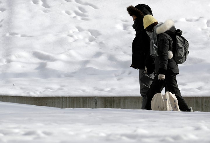 People bundled up against the cold in downtown Chicago on Sunday.