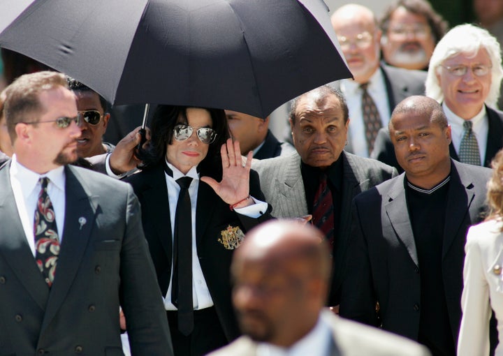 Michael Jackson leaves the Santa Barbara County Courthouse in California after being acquitted on all 10 counts in his 2005 molestation trial. With him (from left) are his father, Joe Jackson; his brother Randy Jackson; and his attorney Thomas Mesereau Jr.