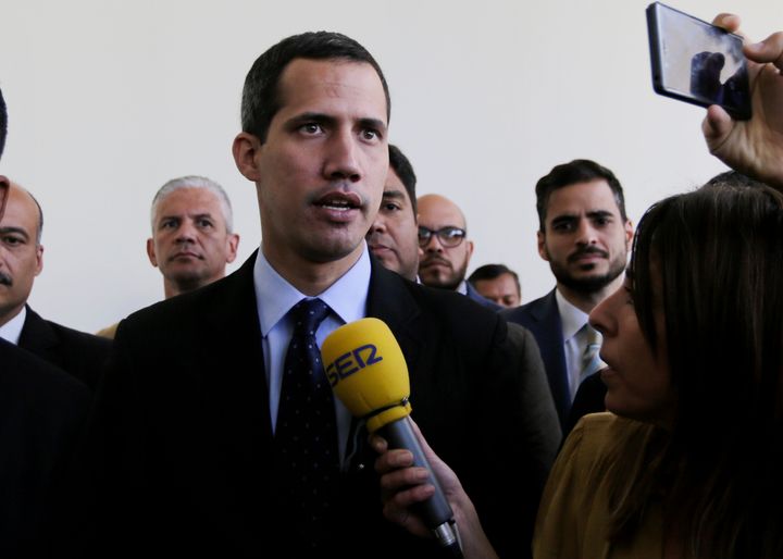 Opposition National Assembly President Juan Guaido, who declared himself interim president of Venezuela, speaks with the media upon his arrival to National Assembly in Caracas on Tuesday.